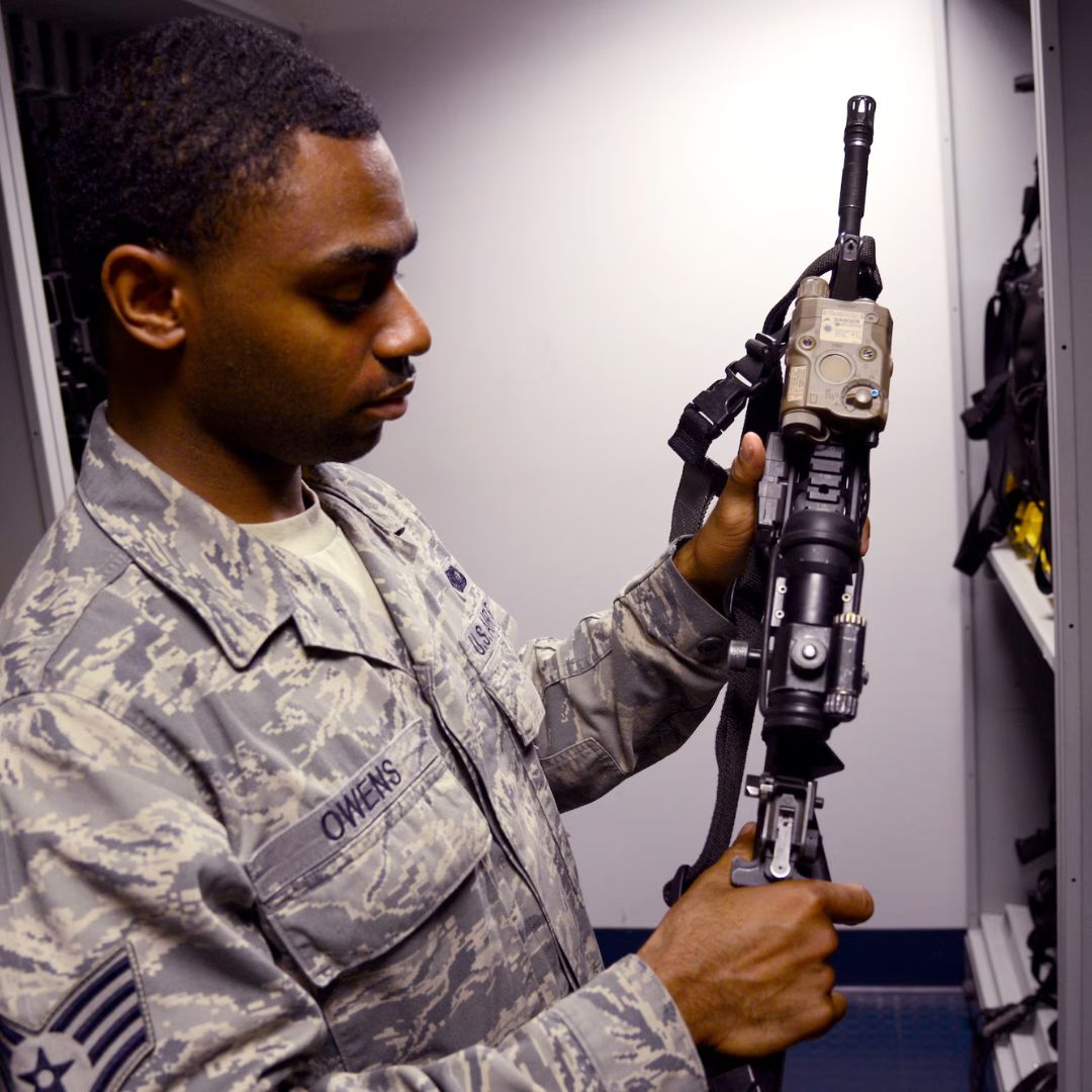 User-supplied TrackerIoT portfolio photograph of personnel handling equipment in an armoury